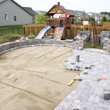 Paving patio on to levelled sand. Backyard Project - Turnkey Paver Patios